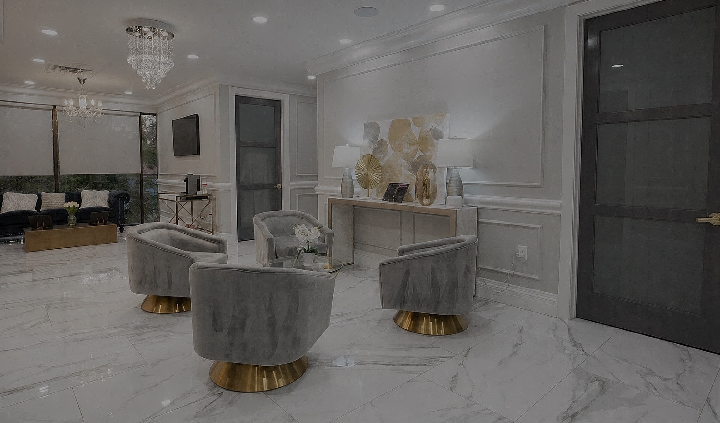 Modern living room with elegant decor and lighting.