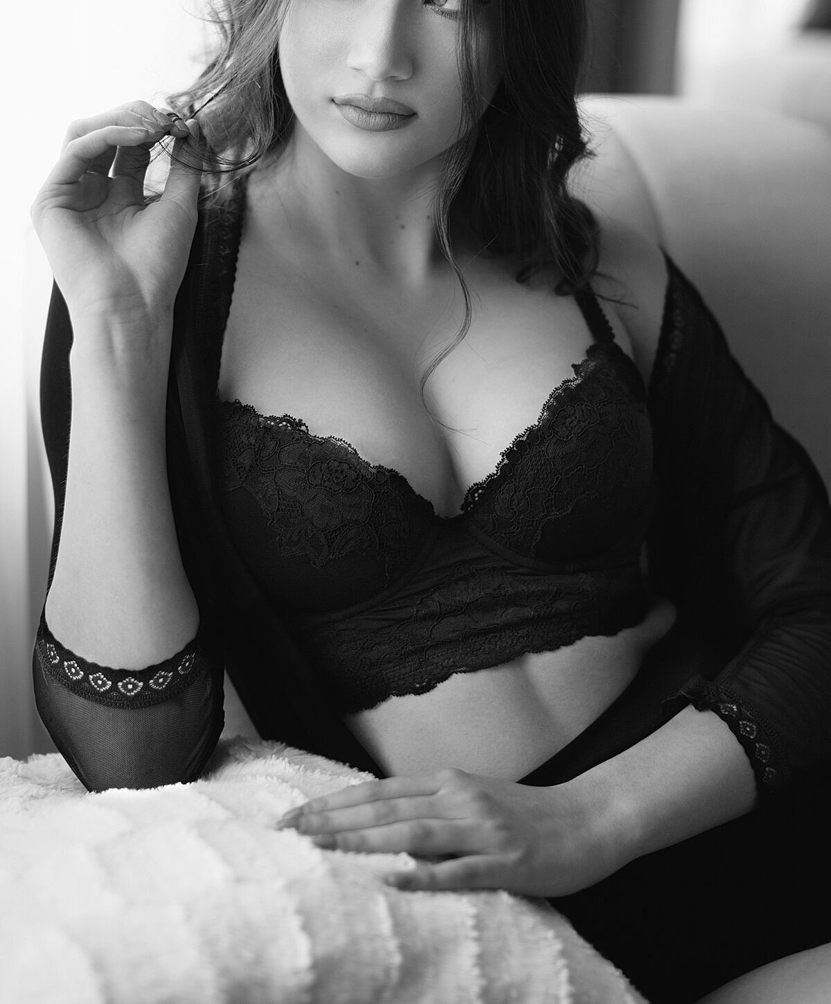 Black lace lingerie portrait in monochrome lighting