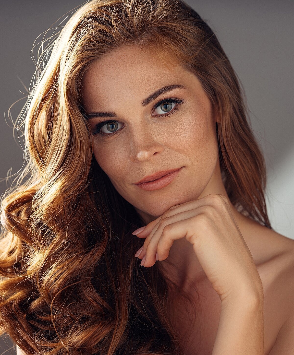 Close-up of a woman with wavy hair.
