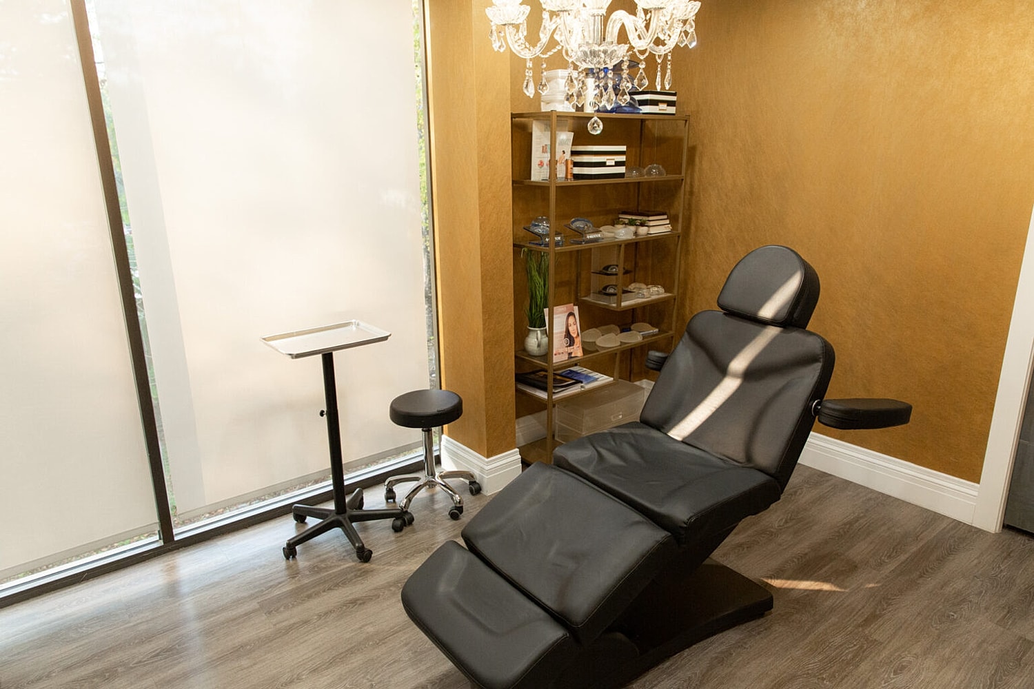 Modern aesthetic treatment room with adjustable chair.