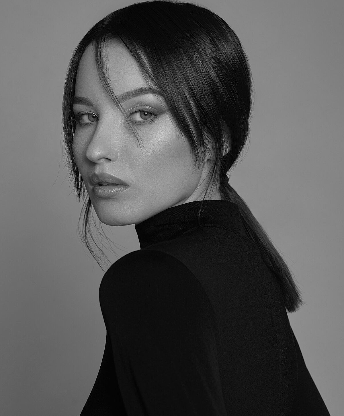 Black and white portrait of a woman.