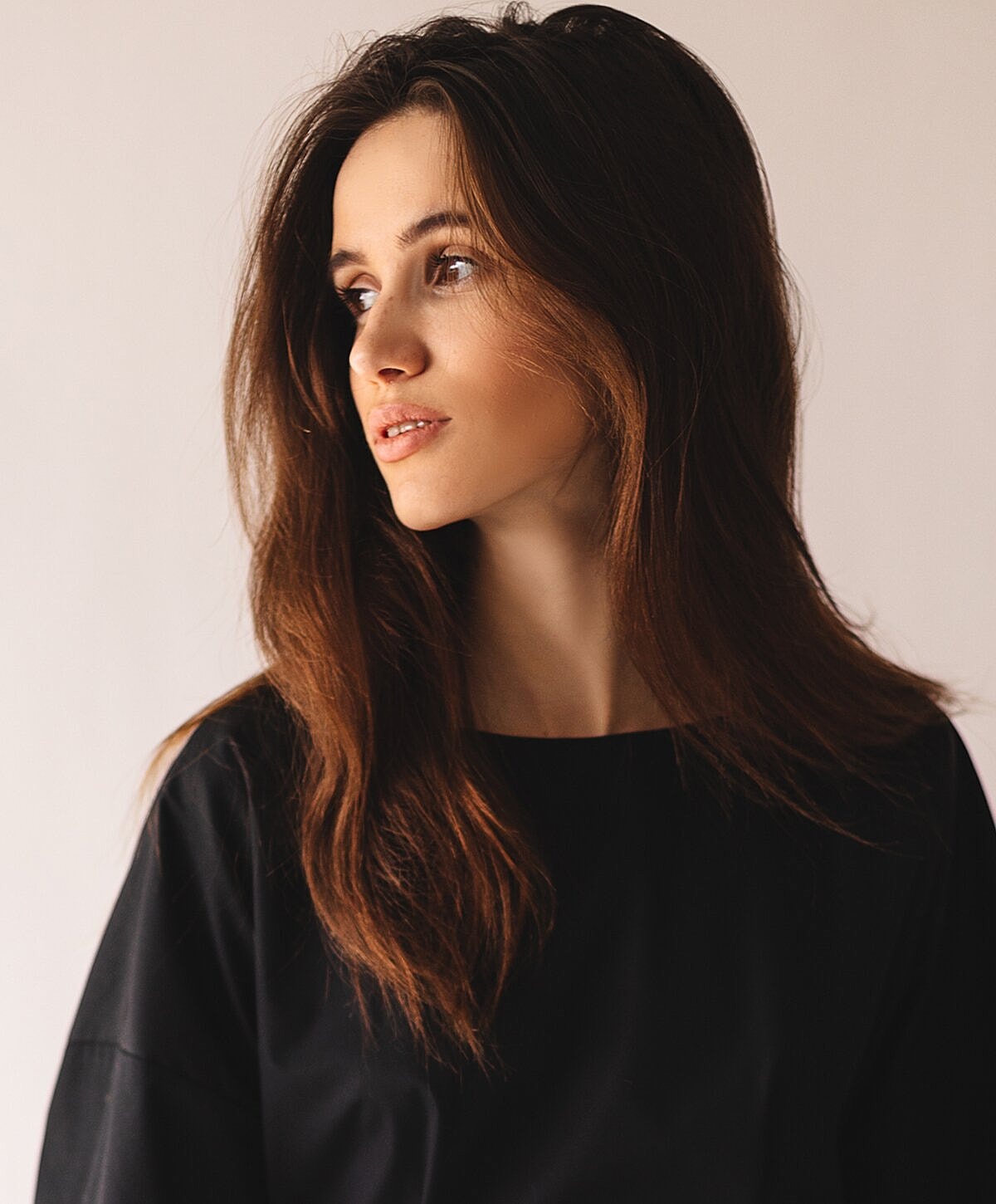 Portrait of a woman with long hair.