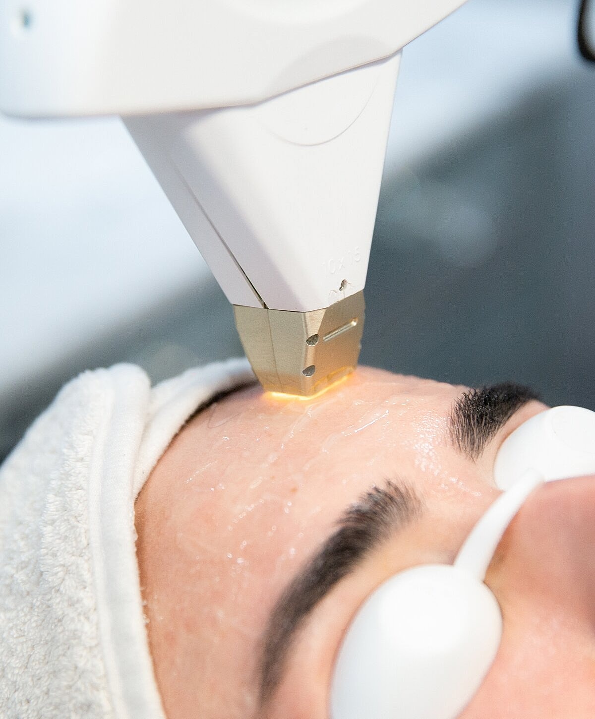 Facial treatment using advanced skincare technology.