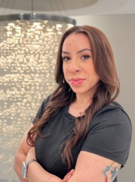 Woman posing confidently in a stylish setting.