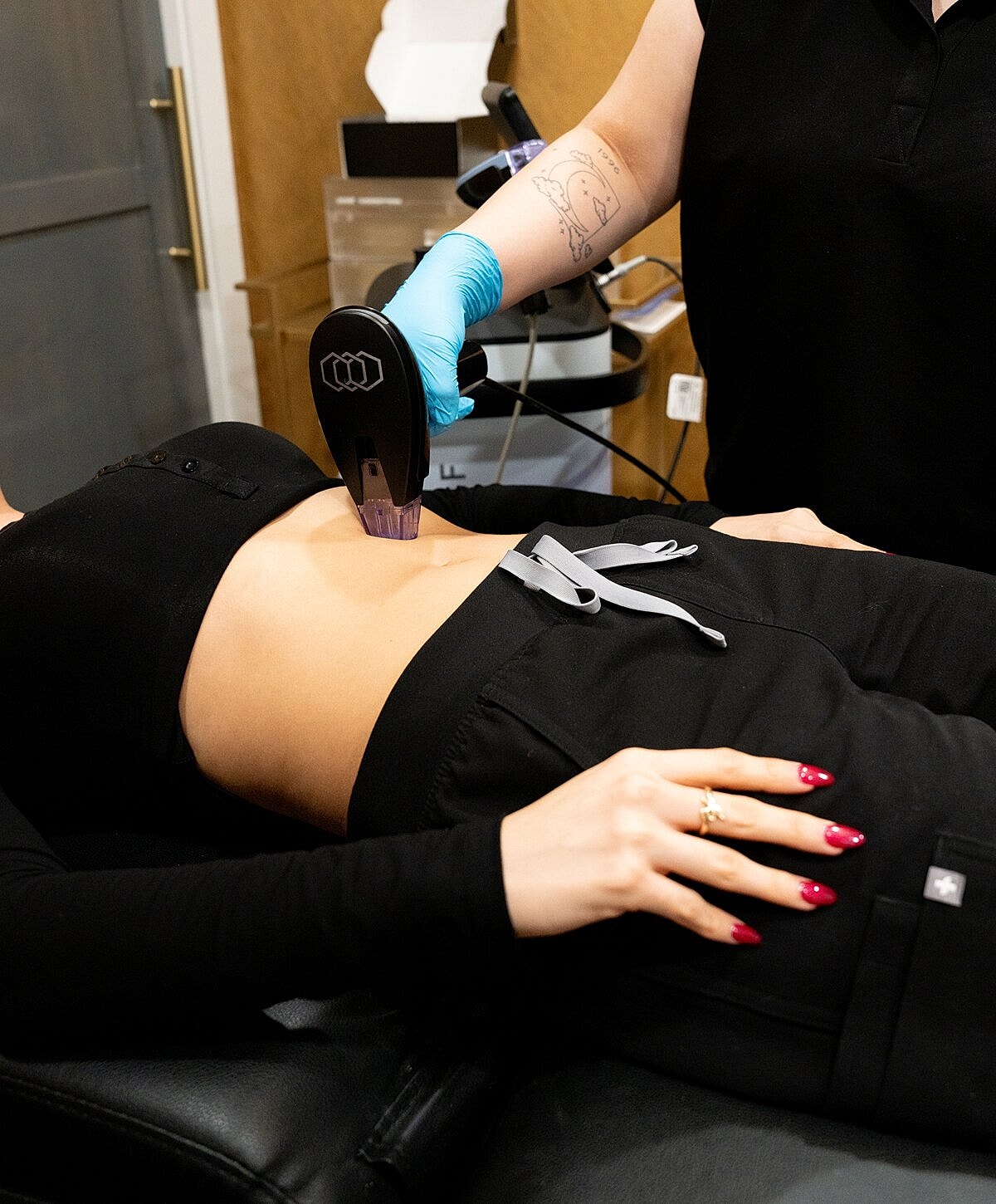 Laser treatment being applied on abdomen.