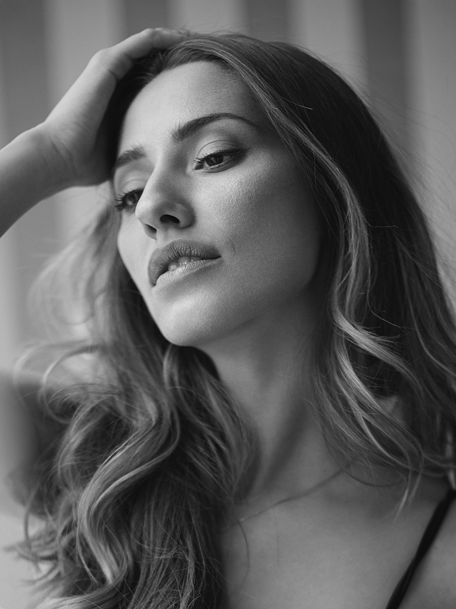 Black and white portrait of a contemplative woman.
