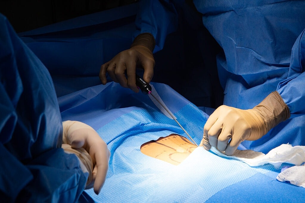 Surgeons performing a surgical procedure in operation room