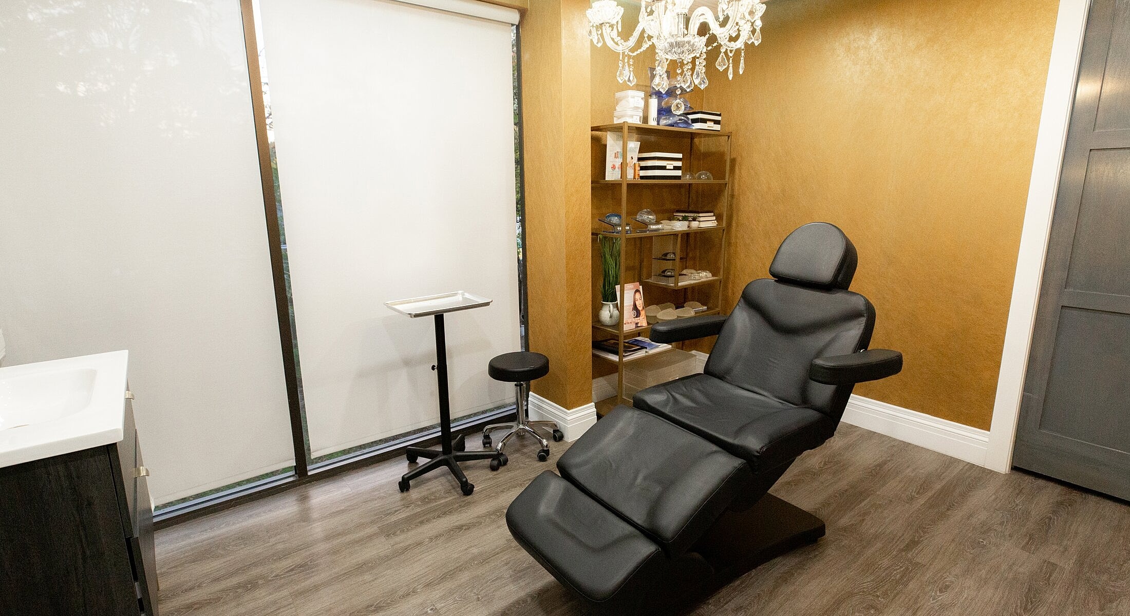 Modern aesthetic treatment room with adjustable chair.