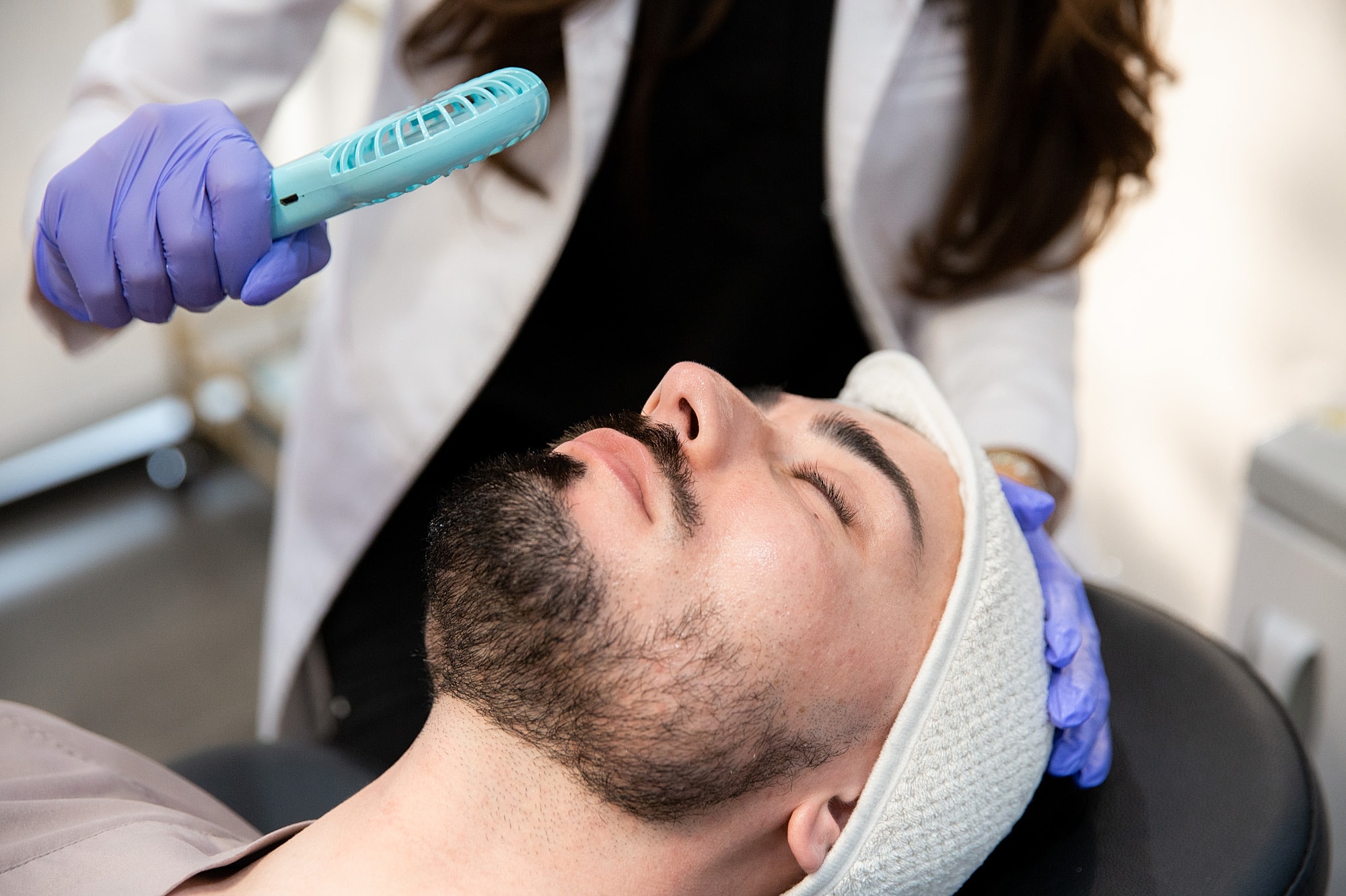 Facial treatment session in a skincare clinic.