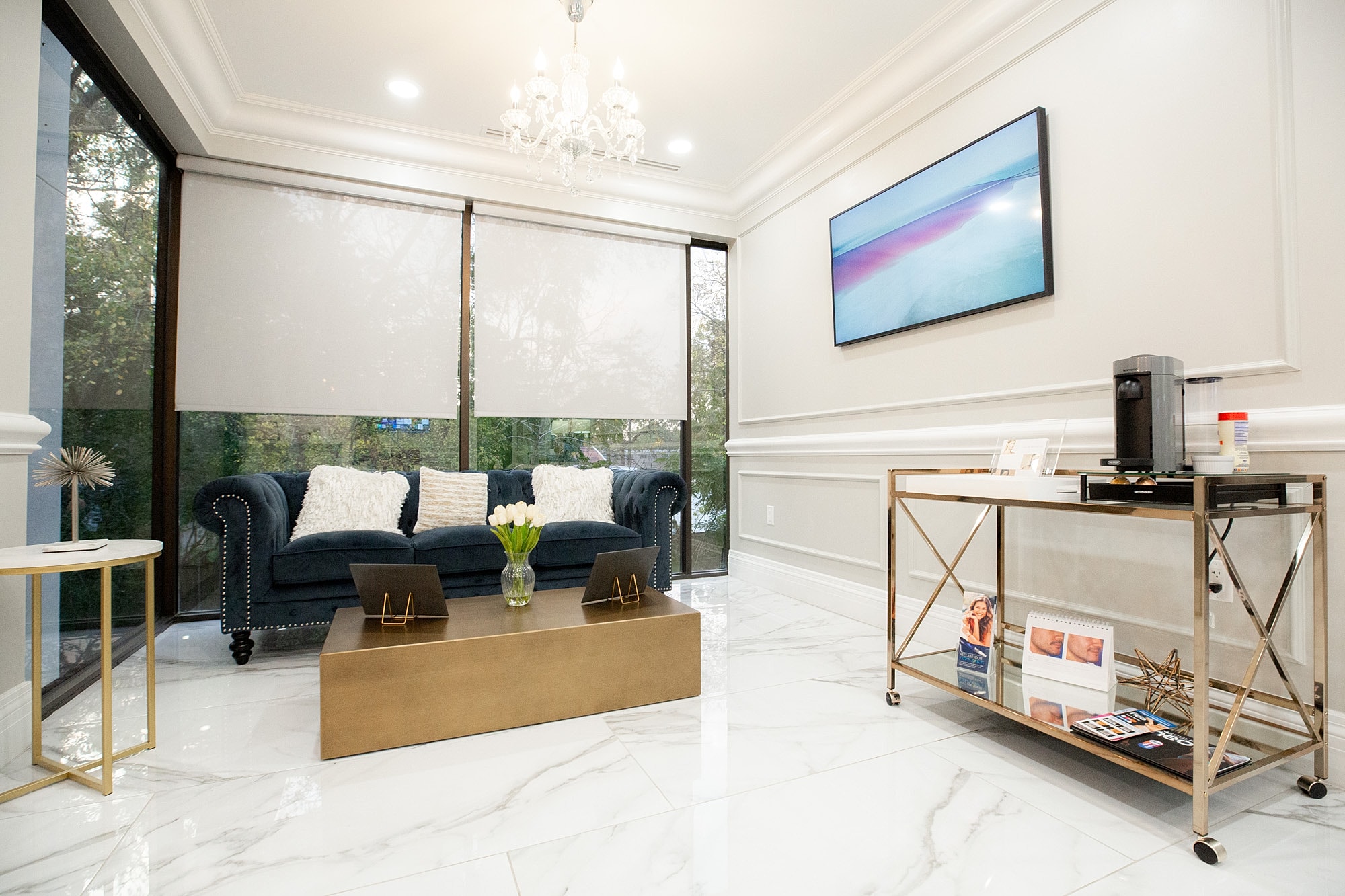 Modern living room with coffee station and decor.